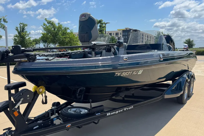 Slide: The Image of 2020 Ranger 2080MS Angler boat on trailer, parked outdoors under a clear sky. - 5