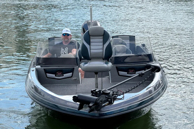 Slide: The Image of 2020 Ranger 2080MS Angler boat on water with a person at the helm. - 9