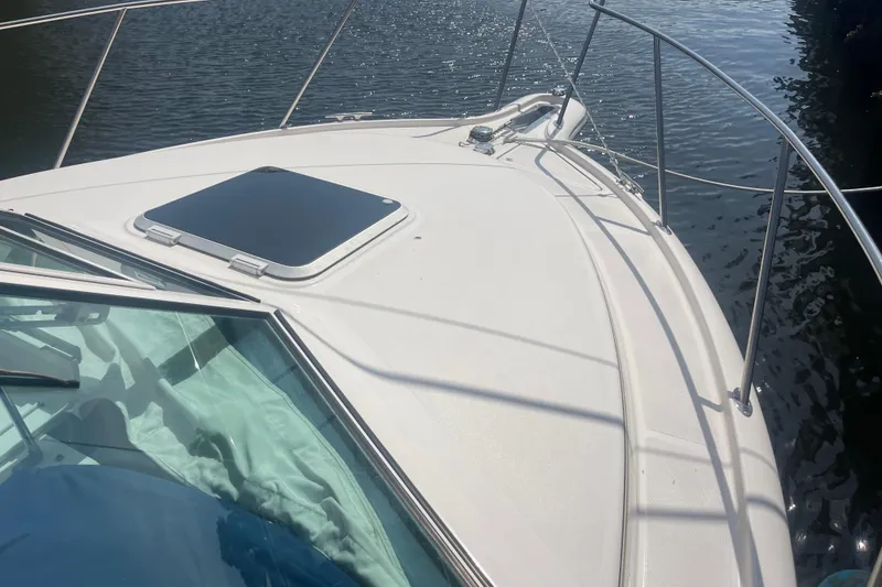 Slide: The Image of 2001 Tiara Yachts 2900 Coronet bow view on calm water. - 16