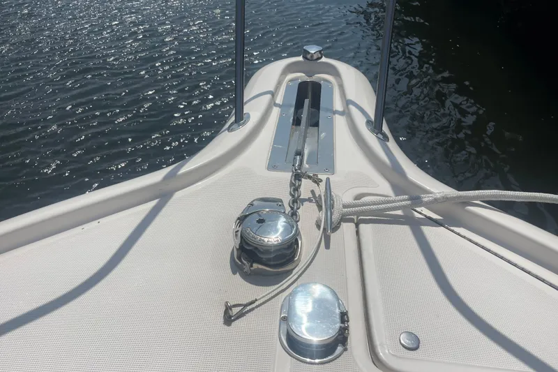 Slide: The Image of Bow of 2001 Tiara Yachts 2900 Coronet with anchor and rope on water. - 17