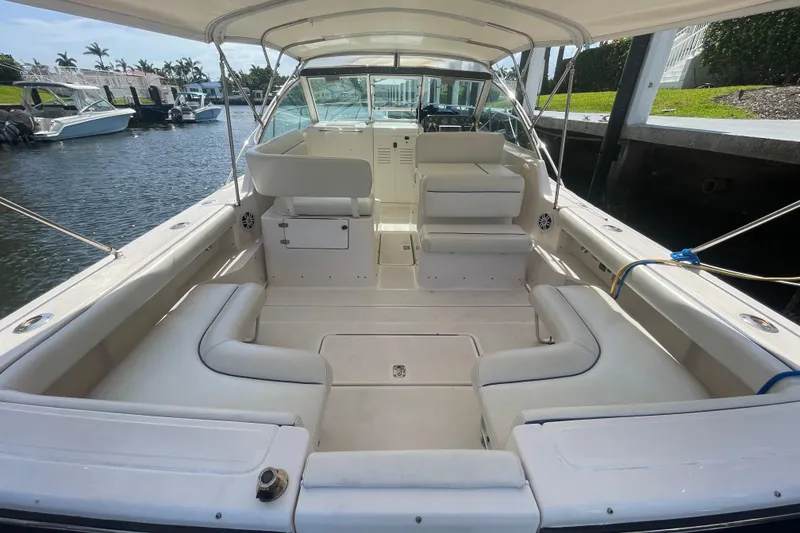 Slide: The Image of 2001 Tiara Yachts 2900 Coronet with spacious seating, docked by the water. - 22