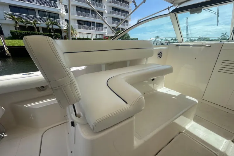 Slide: The Image of 2001 Tiara Yachts 2900 Coronet interior with white seating and waterfront view. - 28