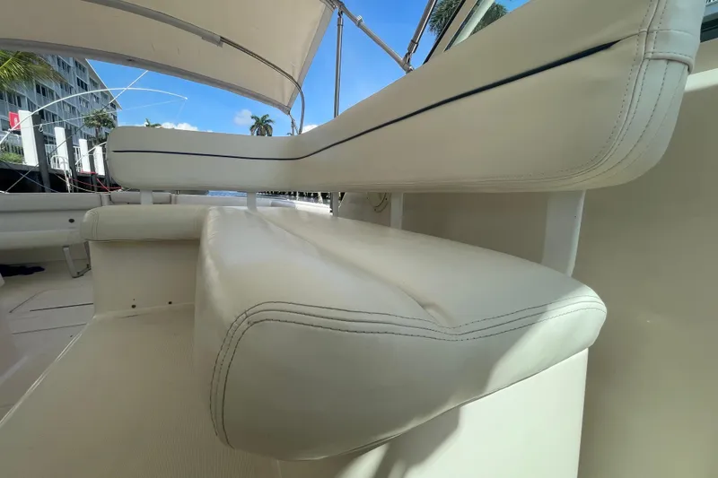 Slide: The Image of 2001 Tiara Yachts 2900 Coronet interior seating with white upholstery and canopy. - 30
