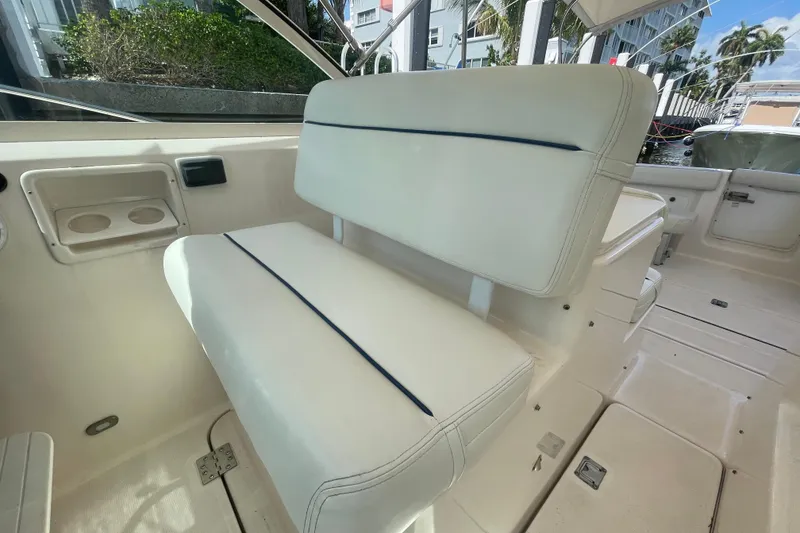 Slide: The Image of 2001 Tiara Yachts 2900 Coronet interior with white seating and cup holders. - 31