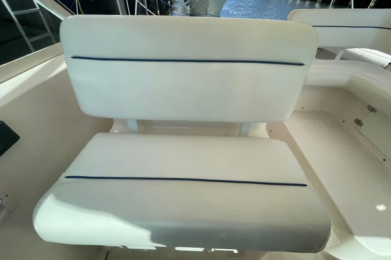 Slide: The Image of White seating on a 2001 Tiara Yachts 2900 Coronet boat, featuring blue accents. - 32