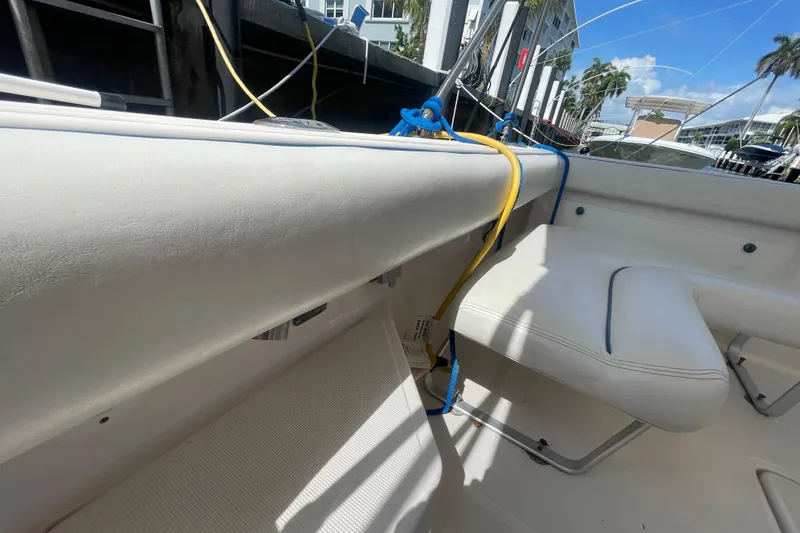Slide: The Image of 2001 Tiara Yachts 2900 Coronet interior with white seating and colorful ropes. - 36