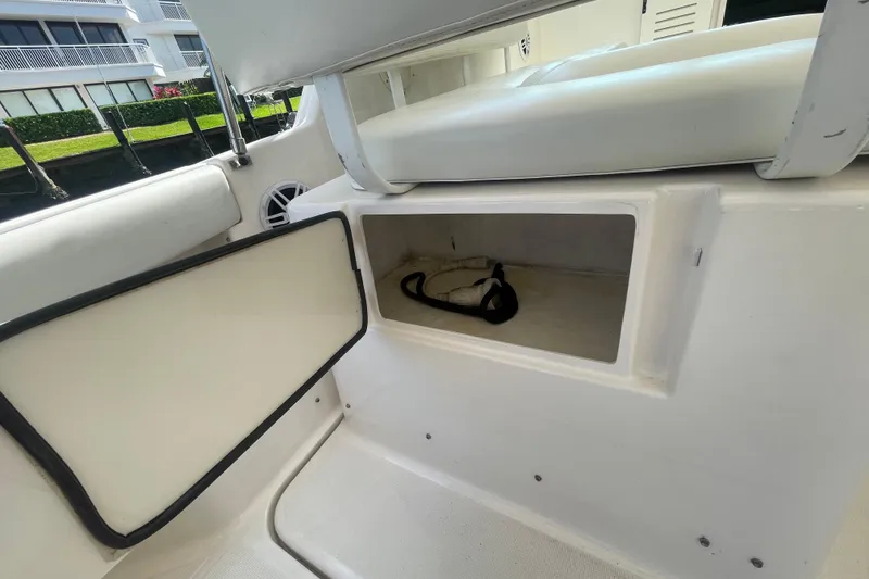 Slide: The Image of 2001 Tiara Yachts 2900 Coronet interior storage compartment with open door. - 38