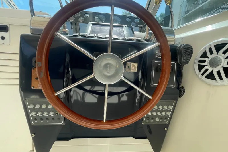 Slide: The Image of Steering wheel of a 2001 Tiara Yachts 2900 Coronet with control panel. - 41