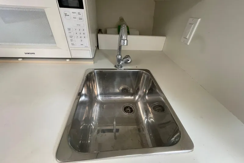 Slide: The Image of Stainless steel sink and faucet in Tiara Yachts 2900 Coronet, 2001 model kitchen area. - 49