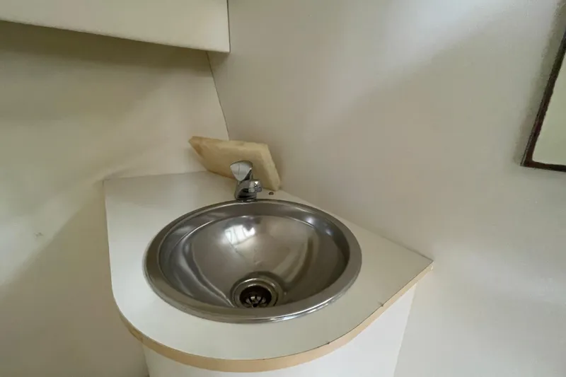 Slide: The Image of 2001 Tiara Yachts 2900 Coronet interior sink with modern design and stainless steel finish. - 54