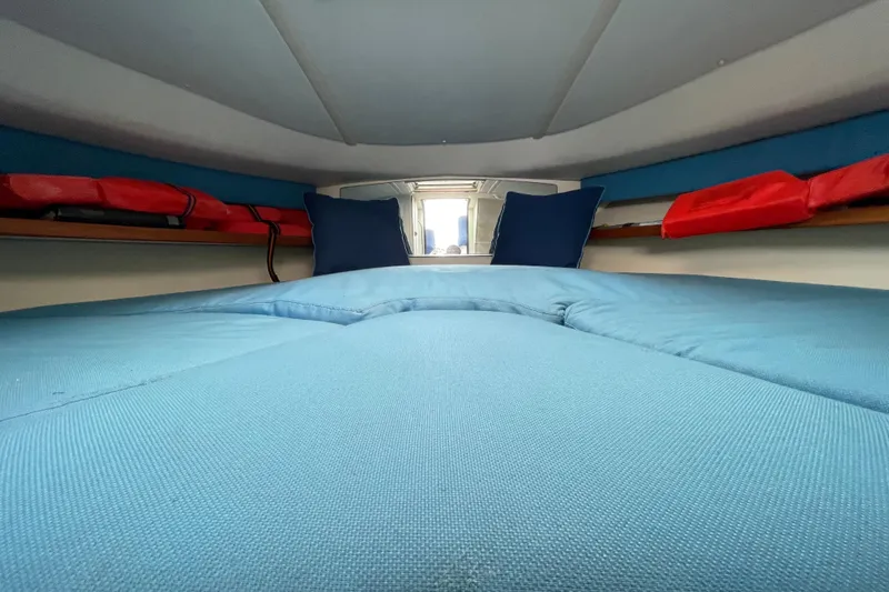 Slide: The Image of Interior cabin of 2001 Tiara Yachts 2900 Coronet with blue bedding and cushions. - 55