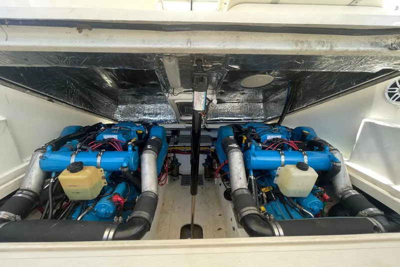 Slide: The Image of Engine compartment of a 2001 Tiara Yachts 2900 Coronet with dual blue engines. - 58