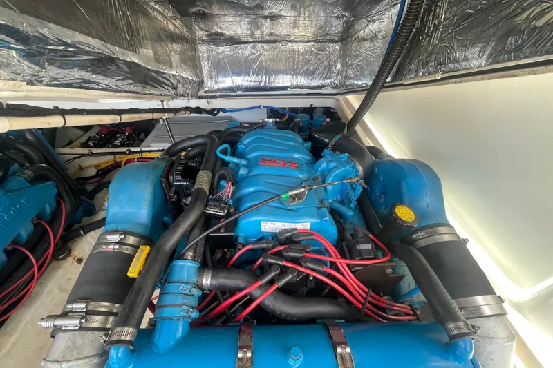 Slide: The Image of Engine compartment of a 2001 Tiara Yachts 2900 Coronet, showcasing detailed mechanical components. - 60