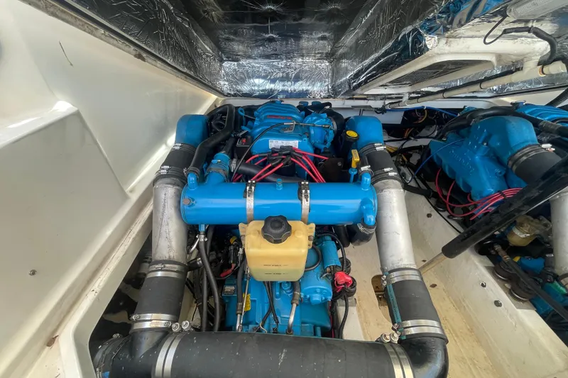 Slide: The Image of Engine compartment of a 2001 Tiara Yachts 2900 Coronet, showcasing blue engine components. - 61