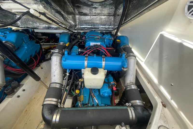 Slide: The Image of Engine compartment of a 2001 Tiara Yachts 2900 Coronet, showcasing blue engine components. - 62