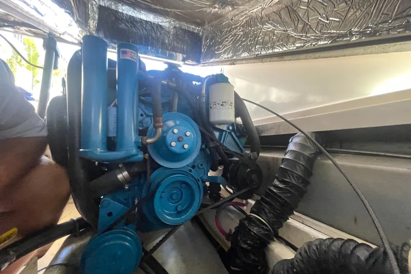 Slide: The Image of Engine compartment of a 2001 Tiara Yachts 2900 Coronet, showcasing mechanical components. - 63