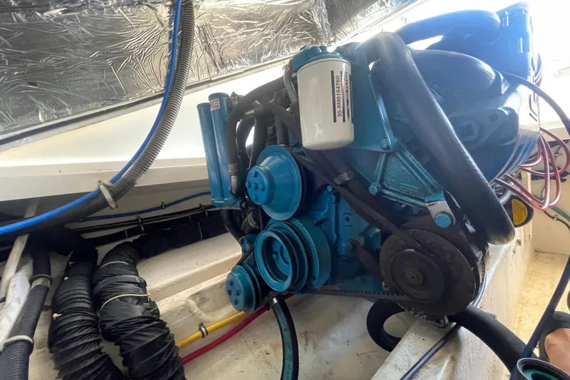 Slide: The Image of Engine compartment of a 2001 Tiara Yachts 2900 Coronet, showcasing mechanical components. - 64