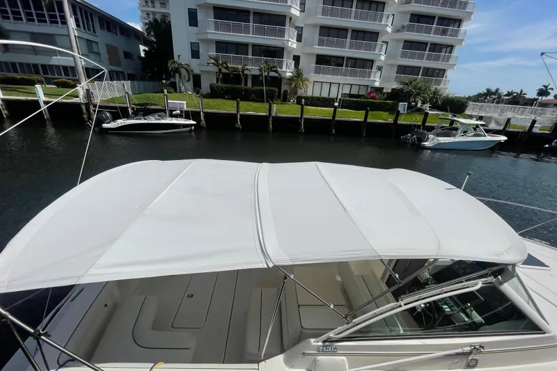 Slide: The Image of 2001 Tiara Yachts 2900 Coronet docked near waterfront buildings. - 66