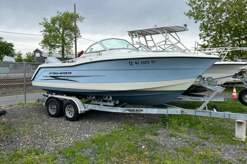 The Image of 2004 Hydra-Sports Lightning 202 DC boat on trailer, parked outdoors. - 0