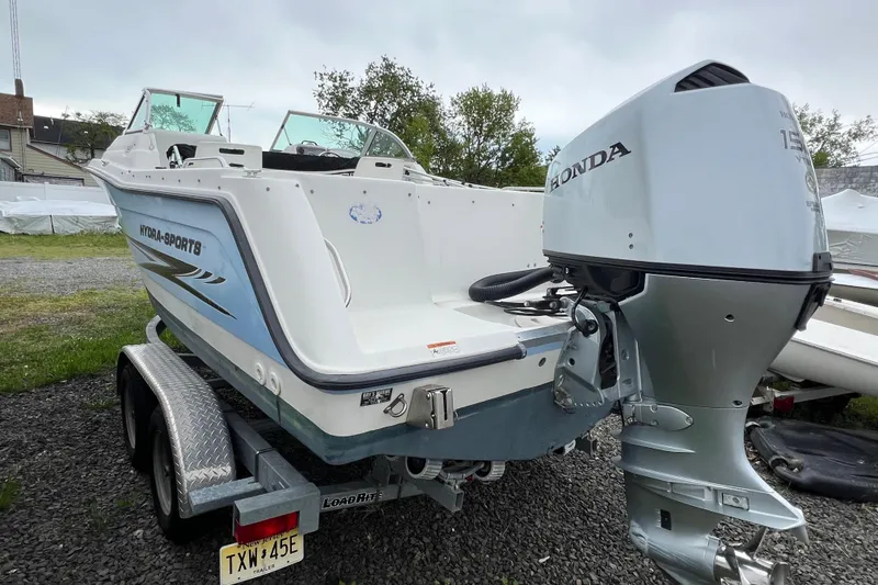 Slide: The Image of 2004 Hydra-Sports Lightning 202 DC boat with Honda outboard motor on trailer. - 2