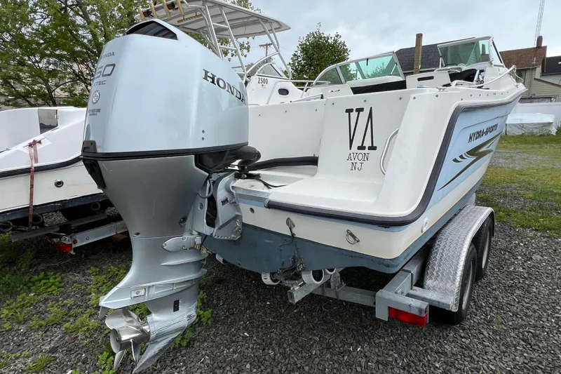 Slide: The Image of 2004 Hydra-Sports Lightning 202 DC boat with Honda outboard motor on trailer. - 3