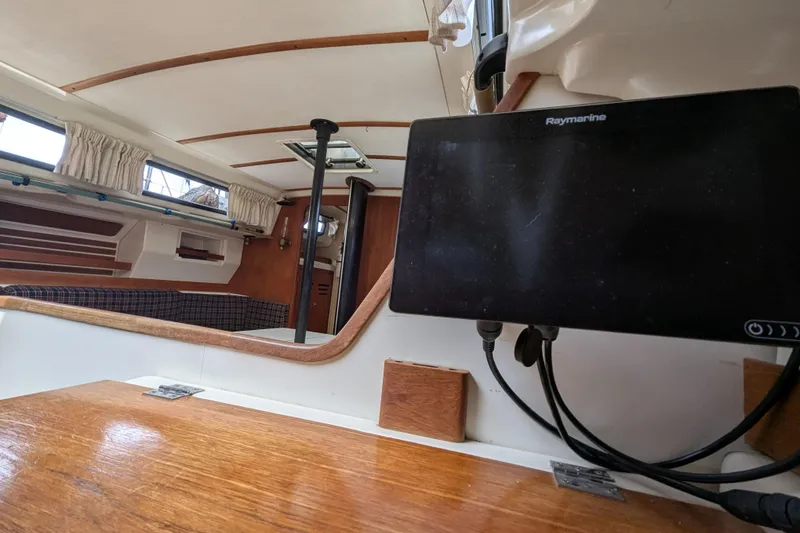 Slide: The Image of Interior of a 1982 Pearson 323 sailboat with Raymarine navigation system. - 10