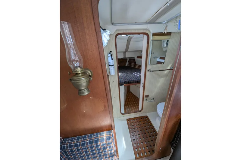 Slide: The Image of Interior of a 1982 Pearson 323 sailboat, featuring a cozy cabin and vintage decor. - 17