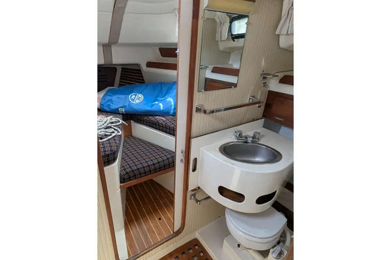 Slide: The Image of Interior of 1982 Pearson 323 sailboat with compact bathroom and cozy cabin. - 20