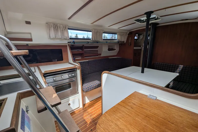 Slide: The Image of Interior of a 1982 Pearson 323 sailboat with kitchen and seating area. - 3