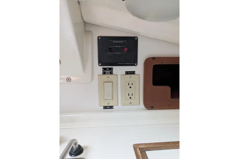 Slide: The Image of Electrical panel and outlet on a 1982 Pearson 323 sailboat interior. - 30