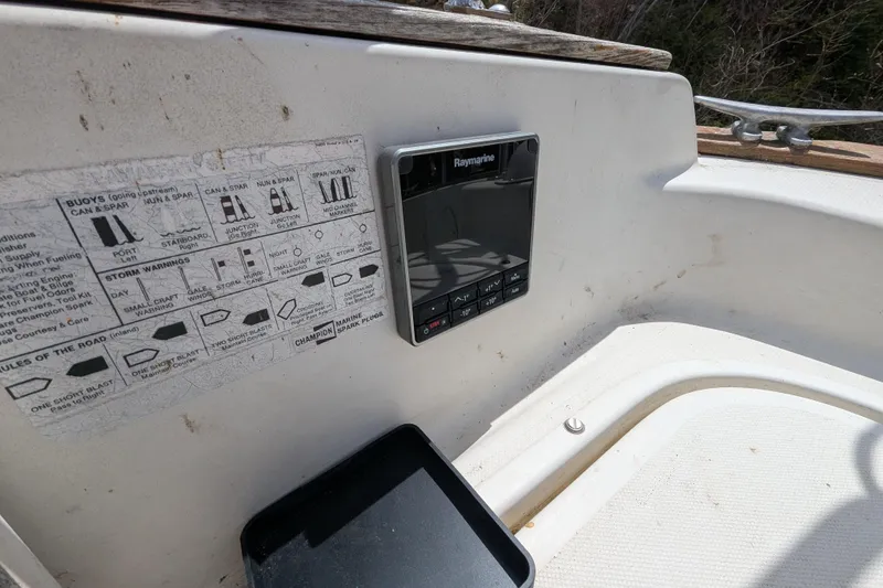 Slide: The Image of Cockpit of 1982 Pearson 323 sailboat with Raymarine navigation system and buoy chart. - 40