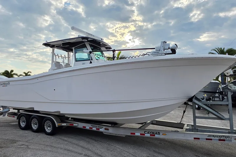 The Image of 2025 Caymas 34 CT boat on trailer under cloudy sky. - 1