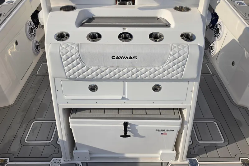 Slide: The Image of 2025 Caymas 34 CT boat interior with storage and cup holders. - 12