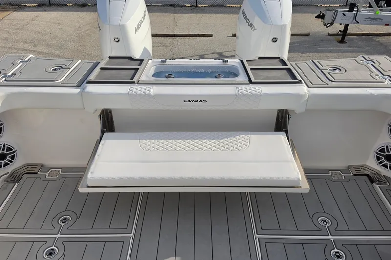 Slide: The Image of 2025 Caymas 34 CT boat deck with seating and Mercury engines. - 14