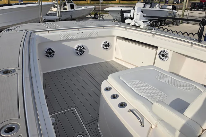 Slide: The Image of 2025 Caymas 34 CT boat interior with cushioned seating and modern design. - 21