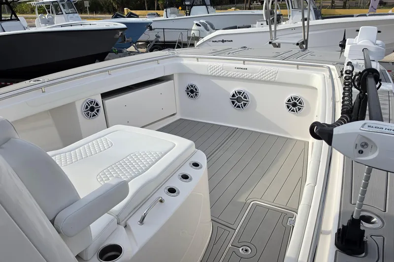 Slide: The Image of 2025 Caymas 34 CT boat interior with seating, speakers, and modern design. - 22