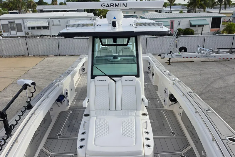 Slide: The Image of 2025 Caymas 34 CT boat with Garmin equipment, docked in a marina setting. - 25