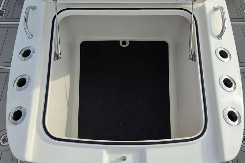 Slide: The Image of Open storage compartment on 2025 Caymas 34 CT boat deck. - 28