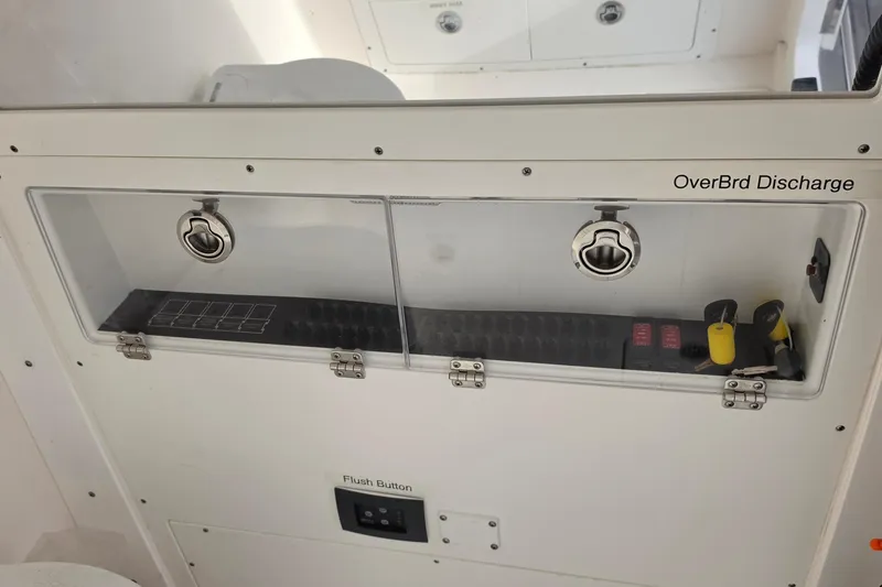Slide: The Image of Control panel of 2025 Caymas 34 CT boat with labeled switches and keys. - 34