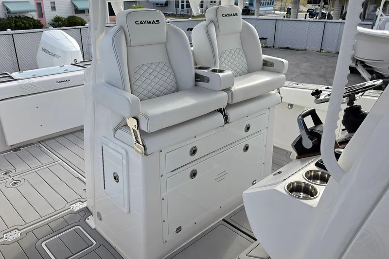Slide: The Image of 2025 Caymas 34 CT boat interior with luxurious seating and modern console design. - 37