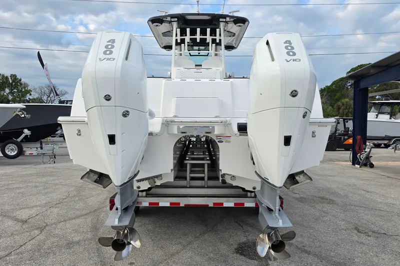 Slide: The Image of 2025 Caymas 34 CT boat with dual 400 V10 engines, rear view. - 5