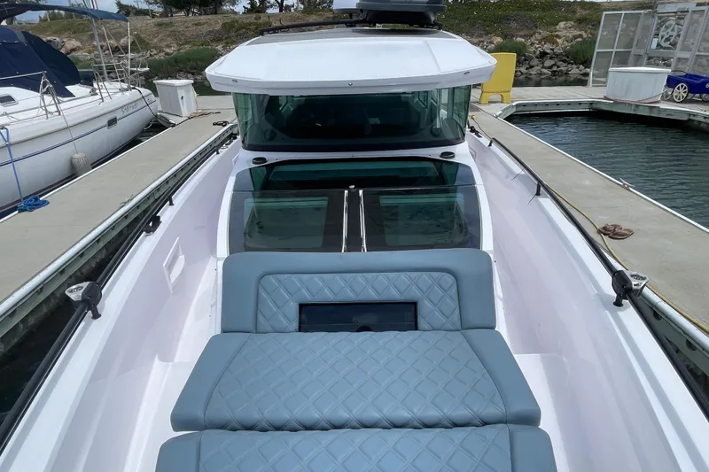 Slide: The Image of 2023 Axopar Brabus 37 XC Cross Cabin at dock, luxurious design. - 10