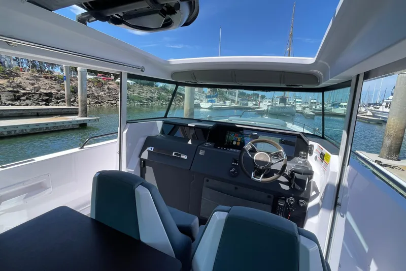 Slide: The Image of Interior view of 2023 Axopar 37 XC Cross Cabin boat at marina. - 17