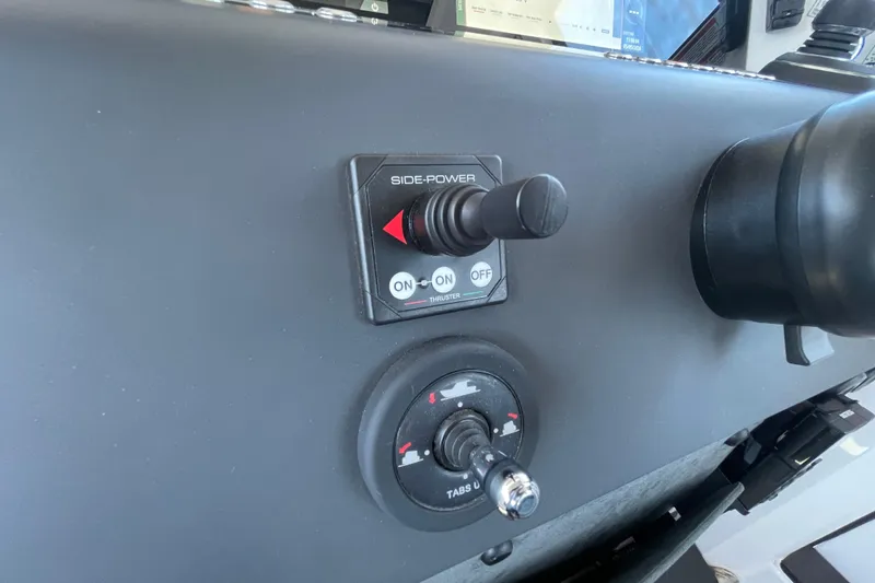 Slide: The Image of Control panel of 2023 Axopar 37 XC Cross Cabin with side-power joystick. - 26