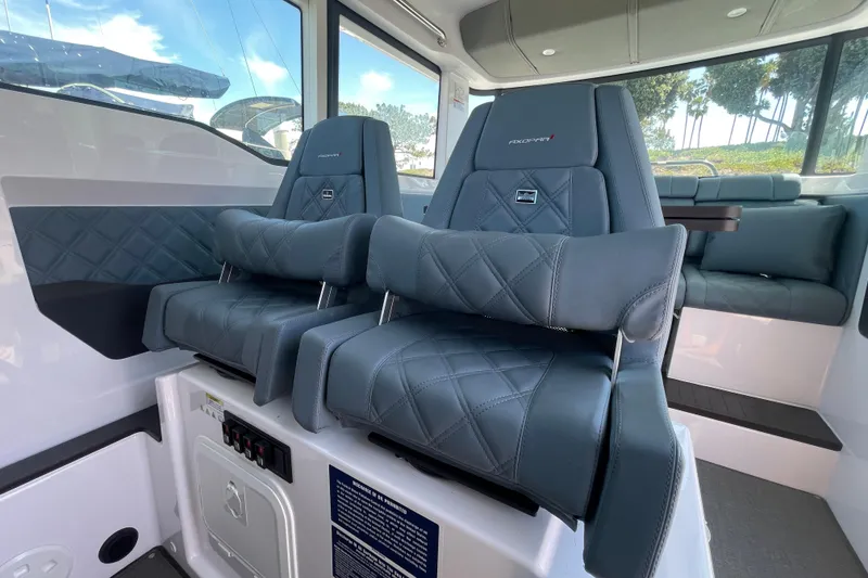Slide: The Image of 2023 Axopar 37 XC Cross Cabin interior with luxurious seating and modern design. - 27