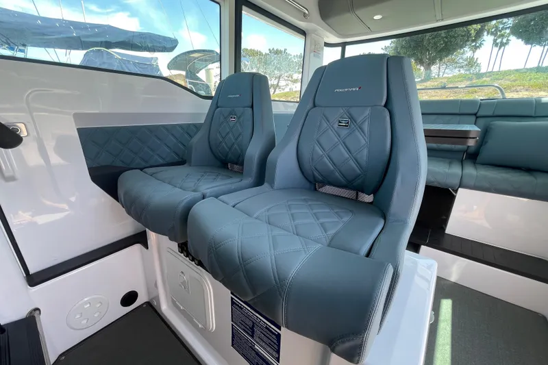 Slide: The Image of Interior of 2023 Axopar 37 XC Cross Cabin with luxurious seating and modern design. - 28