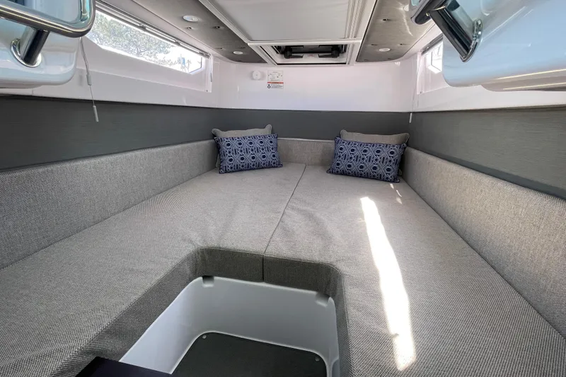 Slide: The Image of Luxurious interior cabin of 2023 Axopar 37 XC Cross Cabin with modern seating and cushions. - 33