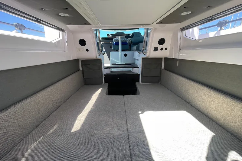 Slide: The Image of 2023 Axopar 37 XC Cross Cabin interior with spacious seating and modern design. - 34