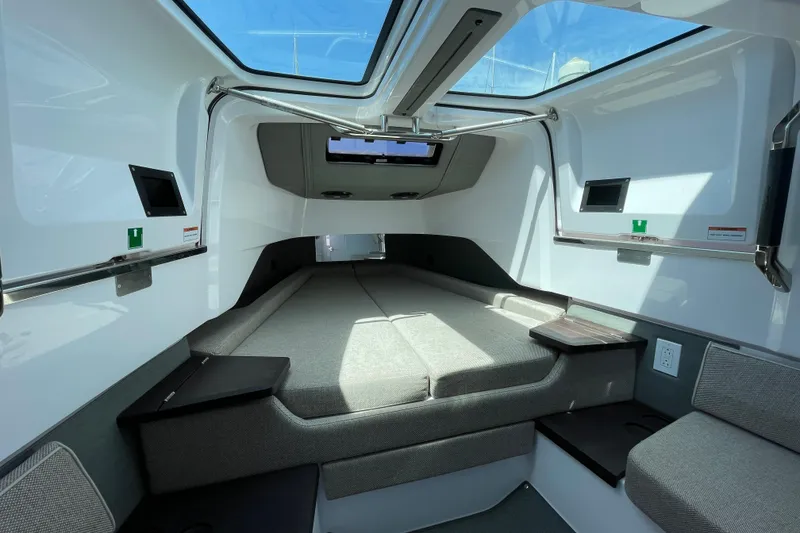 Slide: The Image of 2023 Axopar 37 XC Cross Cabin interior with modern design and comfortable seating. - 37