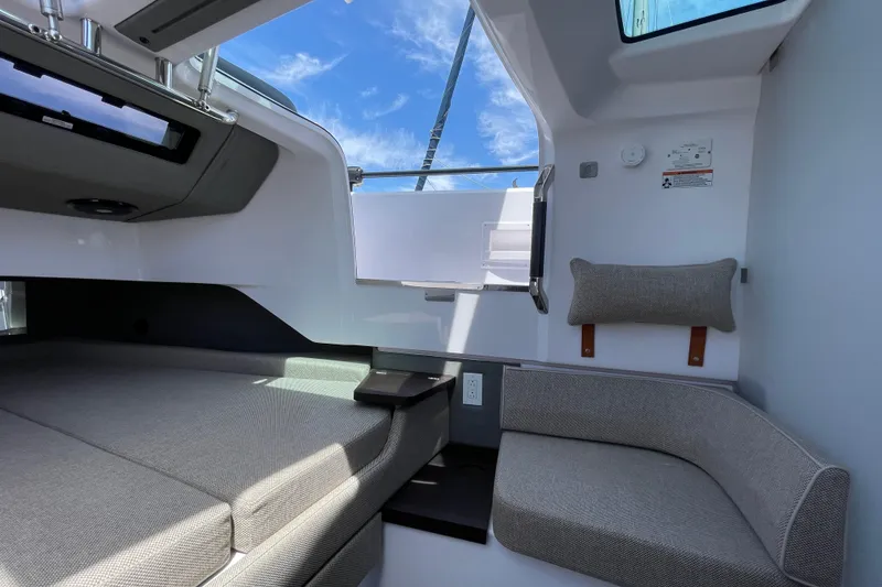 Slide: The Image of Interior of 2023 Axopar 37 XC Cross Cabin, featuring modern seating and sleek design. - 41